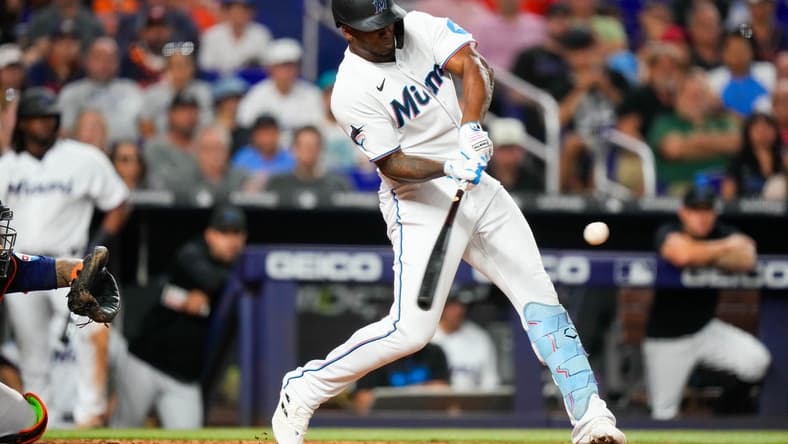 Aug 14, 2023; Miami, Florida, USA; Miami Marlins designated hitter Jorge Soler (12) hits a home run against the Houston Astros during the eighth inning at loanDepot Park. Mandatory Credit: Rich Storry-USA TODAY Sports