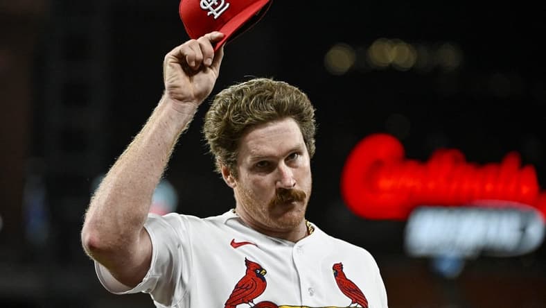 Aug 14, 2023; St. Louis, Missouri, USA;  St. Louis Cardinals starting pitcher Miles Mikolas (39) tips his cap to the fans as he walks off the field after he was removed from the game during the seventh inning against the Oakland Athletics at Busch Stadium. Mandatory Credit: Jeff Curry-USA TODAY Sports