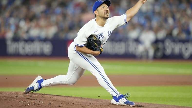 Aug 15, 2023; Toronto, Ontario, CAN; Toronto Blue Jays starting pitcher Yusei Kikuchi (16) pitches to the Philadelphia Phillies during the first inning at Rogers Centre. Mandatory Credit: John E. Sokolowski-USA TODAY Sports
