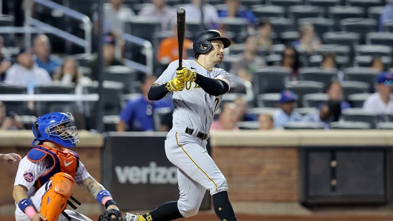Aug 15, 2023; New York City, New York, USA; Pittsburgh Pirates left fielder Bryan Reynolds (10) follows through on an RBI triple against the New York Mets during the seventh inning at Citi Field. Mandatory Credit: Brad Penner-USA TODAY Sports