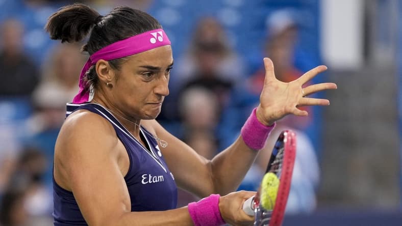 Aug 15, 2023; Mason, OH, USA; Caroline Garcia returns a shot in the first set of a Round of 32 match against Sloane Stephens in the Western & Southern Open at the Lindner Family Tennis Center. Mandatory Credit: Sam Greene-USA TODAY Sports