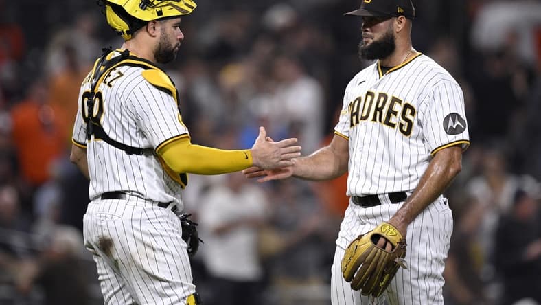 Aug 15, 2023; San Diego, California, USA; San Diego Padres catcher Gary Sanchez (99) and relief pitcher Luis Garcia (right) celebrate after defeating the Baltimore Orioles at Petco Park. Mandatory Credit: Orlando Ramirez-USA TODAY Sports