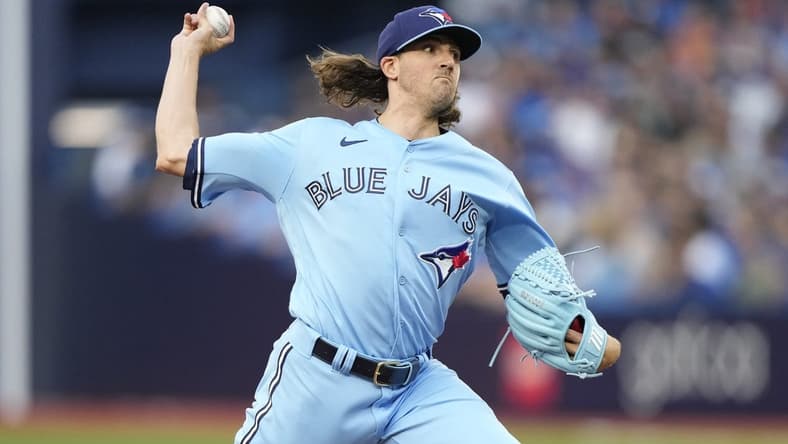 Aug 16, 2023; Toronto, Ontario, CAN; Toronto Blue Jays starting pitcher Kevin Gausman (34) pitches to the Philadelphia Phillies during the first inning at Rogers Centre. Mandatory Credit: John E. Sokolowski-USA TODAY Sports