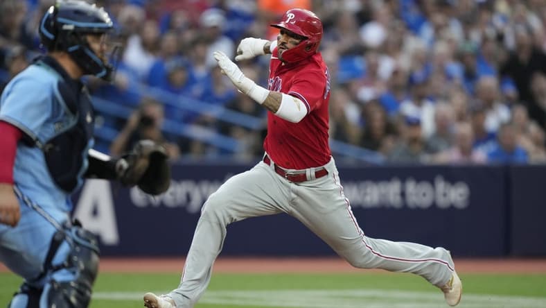 Aug 16, 2023; Toronto, Ontario, CAN; Philadelphia Phillies right fielder Nick Castellanos (8) scores against the Toronto Blue Jays on a sacrifice fly by Philadelphia Phillies left fielder Jake Cave (not pictured) during the second inning at Rogers Centre. Mandatory Credit: John E. Sokolowski-USA TODAY Sports