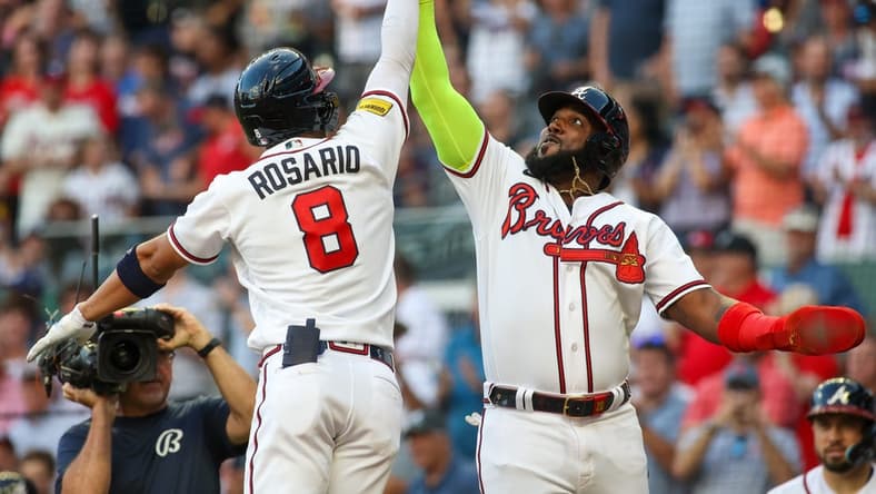 Aug 16, 2023; Atlanta, Georgia, USA; Atlanta Braves left fielder Eddie Rosario (8) celebrates after a home run with designated hitter Marcell Ozuna (20) against the New York Yankees in the second inning at Truist Park. Mandatory Credit: Brett Davis-USA TODAY Sports
