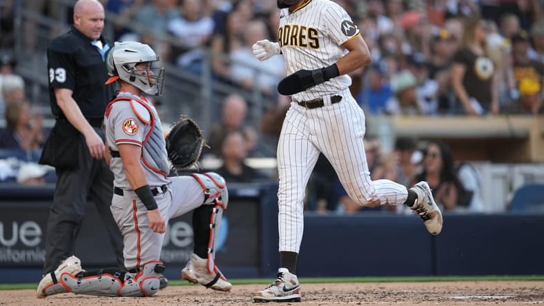 Aug 16, 2023; San Diego, California, USA;  San Diego Padres right fielder Fernando Tatis Jr. (23) scores on an RBI single by first baseman Jake Cronenworth (not pictured) during the third inning against the Baltimore Orioles at Petco Park. Mandatory Credit: Ray Acevedo-USA TODAY Sports