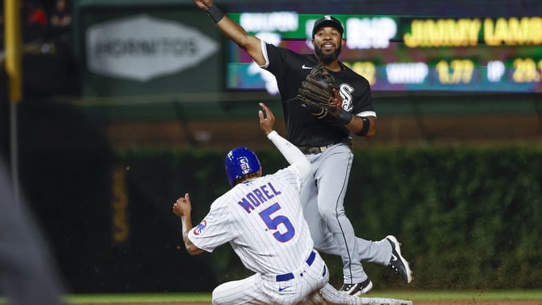 Aug 16, 2023; Chicago, Illinois, USA; Chicago White Sox shortstop Elvis Andrus (1) throws out Chicago Cubs second baseman Christopher Morel (5) at second base during the seventh inning at Wrigley Field. Mandatory Credit: Kamil Krzaczynski-USA TODAY Sports