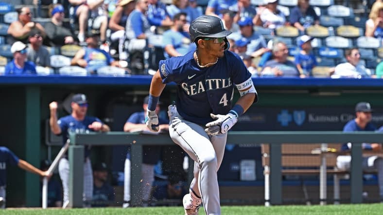 Aug 17, 2023; Kansas City, Missouri, USA;  Seattle Mariners center fielder Julio Rodriguez (44) runs to first base after hitting an RBI single in the second inning against the Kansas City Royals at Kauffman Stadium. Mandatory Credit: Peter Aiken-USA TODAY Sports