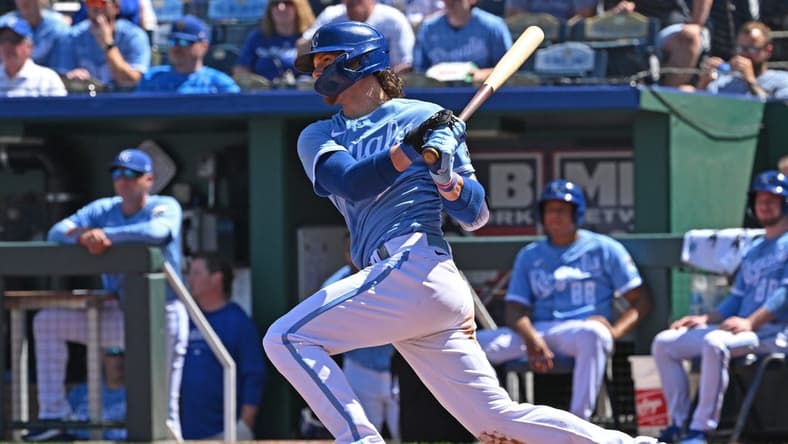 Aug 17, 2023; Kansas City, Missouri, USA;  Kansas City Royals shortstop Bobby Witt Jr. (7) doubles in the sixth inning against the Seattle Mariners at Kauffman Stadium. Mandatory Credit: Peter Aiken-USA TODAY Sports