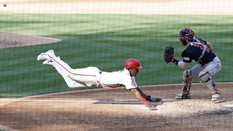 Aug 17, 2023; Washington, District of Columbia, USA; Washington Nationals second baseman Jeter Downs (3) scores a run ahead of a tag by Boston Red Sox catcher Connor Wong (12) on a two run double by Nationals designated hitter Joey Meneses (not pictured) during the fifth inning at Nationals Park. Mandatory Credit: Geoff Burke-USA TODAY Sports