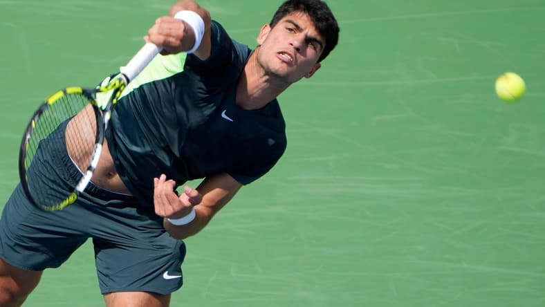 The number one ranked Carlos Alcaraz of Spain, makes a shot to Tommy Paul (14) of the United States on Center Court during the 3rd round of the Western & Southern Open at the Lindner Family Tennis Center in Mason Thursday, August, 17, 2023.