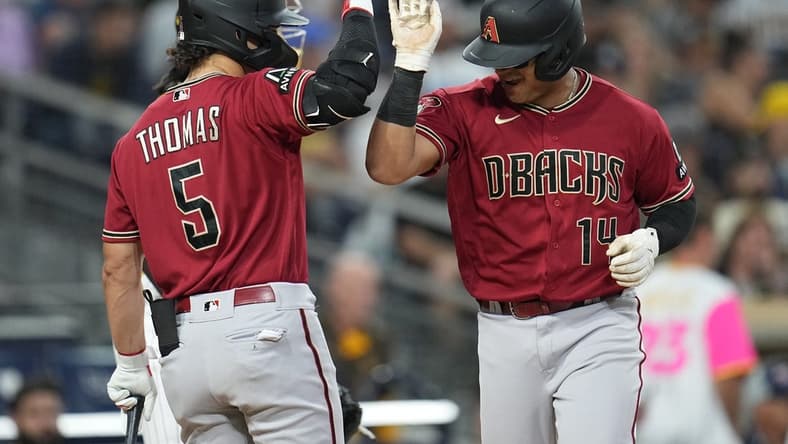 Aug 17, 2023; San Diego, California, USA;  Arizona Diamondbacks catcher Gabriel Moreno (14) is greeted by center fielder Alek Thomas (5) after hitting a solo home run against the San Diego Padres during the fifth inning at Petco Park. Mandatory Credit: Ray Acevedo-USA TODAY Sports