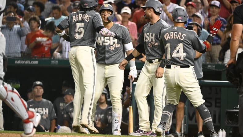 Aug 18, 2023; Washington, District of Columbia, USA; Washington Nationals shortstop CJ Abrams (5) is congratulated by teammates after hitting a three run home run against the Philadelphia Phillies during the fourth inning at Nationals Park. Mandatory Credit: Brad Mills-USA TODAY Sports