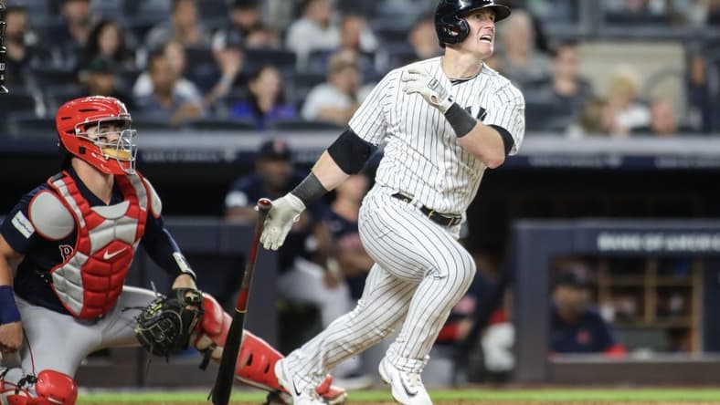 Aug 18, 2023; Bronx, New York, USA; New York Yankees left fielder Billy McKinney (57) hits a single in the fourth inning against the Boston Red Sox at Yankee Stadium. Mandatory Credit: Wendell Cruz-USA TODAY Sports