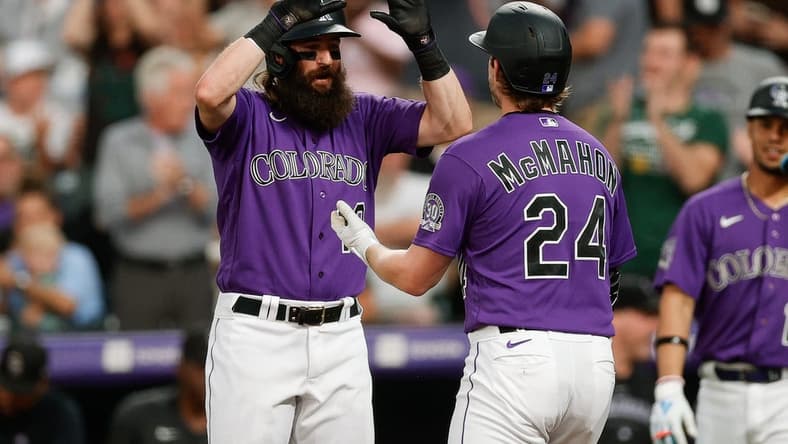 Aug 18, 2023; Denver, Colorado, USA; Colorado Rockies right fielder Charlie Blackmon (19) celebrates the three run home run of third baseman Ryan McMahon (24) in the fourth inning against the Chicago White Sox at Coors Field. Mandatory Credit: Isaiah J. Downing-USA TODAY Sports