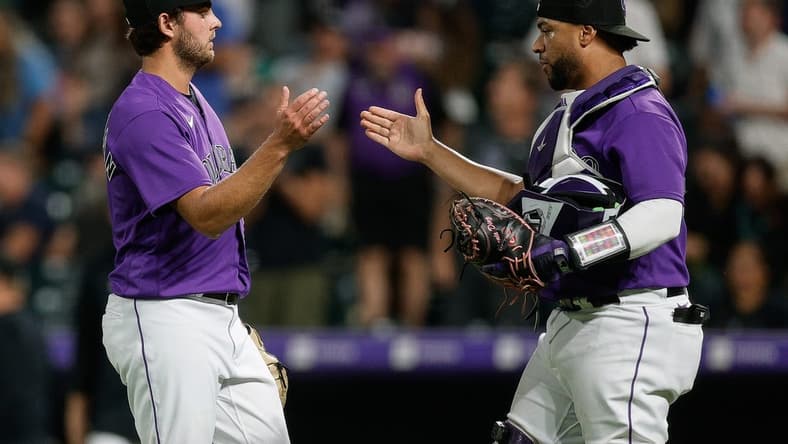 Aug 18, 2023; Denver, Colorado, USA; Colorado Rockies relief pitcher Karl Kauffmann (51) celebrates with catcher Elias Diaz (35) after the game against the Chicago White Sox at Coors Field. Mandatory Credit: Isaiah J. Downing-USA TODAY Sports
