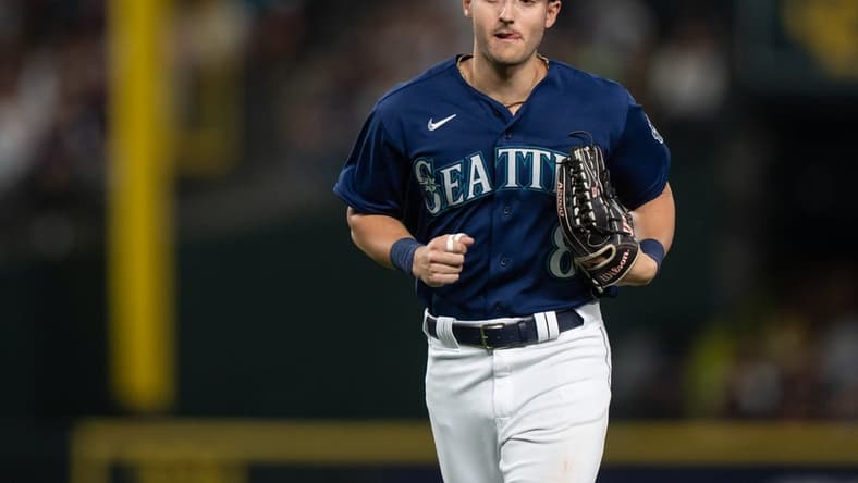 Aug 8, 2023; Seattle, Washington, USA; Seattle Mariners left fielder Dominic Canzone (8) jogs off the field during a game against the San Diego Padres at T-Mobile Park. Mandatory Credit: Stephen Brashear-USA TODAY Sports
