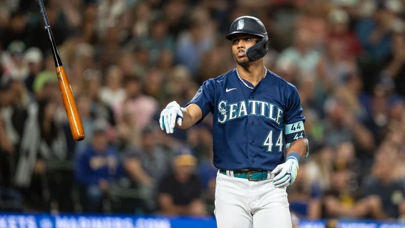 Aug 9, 2023; Seattle, Washington, USA; Seattle Mariners centerfielder Julio Rodriguez (44) tosses his bat after earning a walk against the San Diego Padres at T-Mobile Park. Mandatory Credit: Stephen Brashear-USA TODAY Sports