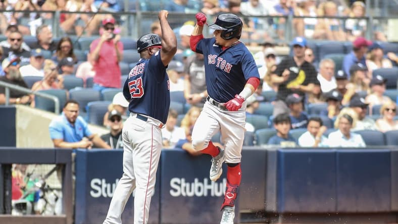 Aug 19, 2023; Bronx, New York, USA;  Boston Red Sox second baseman Luis Urias (17) celebrates with third base coach Carlos Febles after hitting. A home run in the second inning against the New York Yankees at Yankee Stadium. Mandatory Credit: Wendell Cruz-USA TODAY Sports