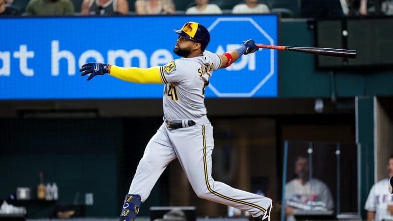 Aug 19, 2023; Arlington, Texas, USA;  Milwaukee Brewers first baseman Carlos Santana (41) hits a home run during the first inning against the Texas Rangers at Globe Life Field. Mandatory Credit: Kevin Jairaj-USA TODAY Sports