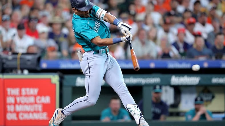 Aug 19, 2023; Houston, Texas, USA; Seattle Mariners center fielder Julio Rodriguez (44) hits a single against the Houston Astros during the first inning during the first inning at Minute Maid Park. Mandatory Credit: Erik Williams-USA TODAY Sports