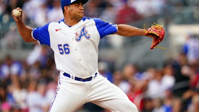 Aug 19, 2023; Cumberland, Georgia, USA; Atlanta Braves relief pitcher Yonny Chirinos (56) cycles through a pitch against the San Francisco Giants during the first inning at Truist Park. Mandatory Credit: John David Mercer-USA TODAY Sports
