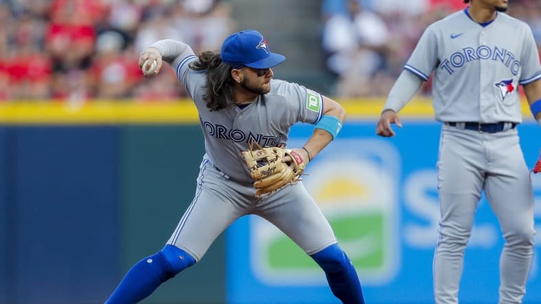 Aug 19, 2023; Cincinnati, Ohio, USA; Toronto Blue Jays shortstop Bo Bichette (11) throws to first to get the out in the third inning at Great American Ball Park. Mandatory Credit: Katie Stratman-USA TODAY Sports