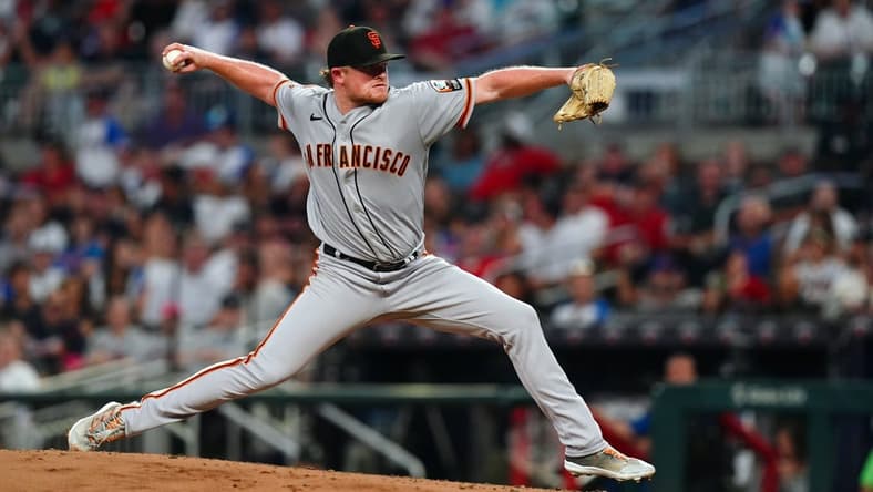 Aug 19, 2023; Cumberland, Georgia, USA; San Francisco Giants starting pitcher Logan Webb (62) pitching against the Atlanta Braves during the fourth inning at Truist Park. Mandatory Credit: John David Mercer-USA TODAY Sports