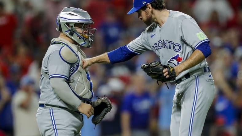 Aug 19, 2023; Cincinnati, Ohio, USA; Toronto Blue Jays relief pitcher Jordan Romano (68) celebrates with catcher Alejandro Kirk (30) after their victory over the Cincinnati Reds at Great American Ball Park. Mandatory Credit: Katie Stratman-USA TODAY Sports