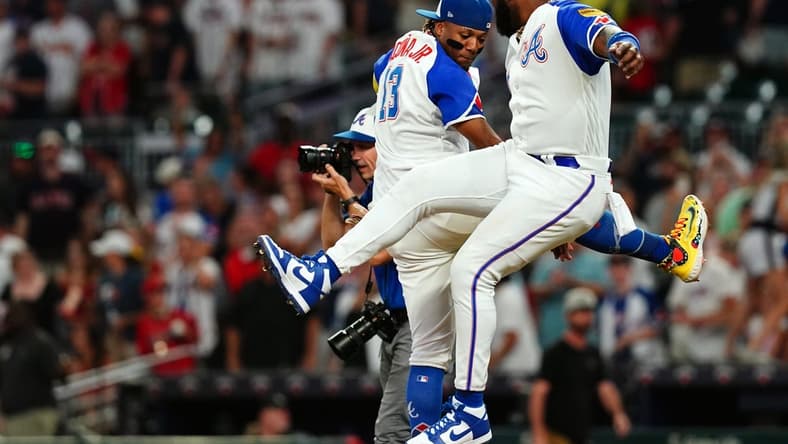 Aug 19, 2023; Cumberland, Georgia, USA; Atlanta Braves right fielder Ronald Acuna Jr. (13) and Atlanta Braves designated hitter Marcell Ozuna (20) celebrate their victory against the San Francisco Giants at Truist Park. Mandatory Credit: John David Mercer-USA TODAY Sports