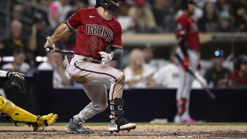 Aug 19, 2023; San Diego, California, USA; Arizona Diamondbacks right fielder Corbin Carroll (7) hits an RBI single against the San Diego Padres during the sixth inning at Petco Park. Mandatory Credit: Orlando Ramirez-USA TODAY Sports