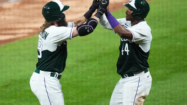 Aug 19, 2023; Denver, Colorado, USA; Colorado Rockies first baseman Elehuris Montero (44) congratulates designated hitter Charlie Blackmon (19) for his two run home run in the seventh inning against the Chicago White Sox at Coors Field. Mandatory Credit: Ron Chenoy-USA TODAY Sports
