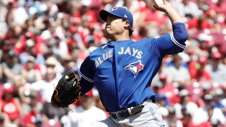 Aug 20, 2023; Cincinnati, Ohio, USA; Toronto Blue Jays starting pitcher Hyun Jin Ryu (99) throws against the Cincinnati Reds during the first inning at Great American Ball Park. Mandatory Credit: David Kohl-USA TODAY Sports