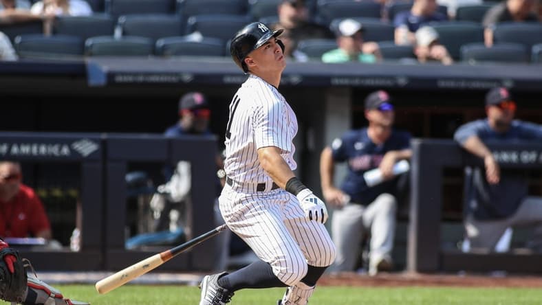 Aug 20, 2023; Bronx, New York, USA; New York Yankees shortstop Anthony Volpe (11) hits a game tying three-run home run in the seventh inning against the Boston Red Sox at Yankee Stadium. Mandatory Credit: Wendell Cruz-USA TODAY Sports