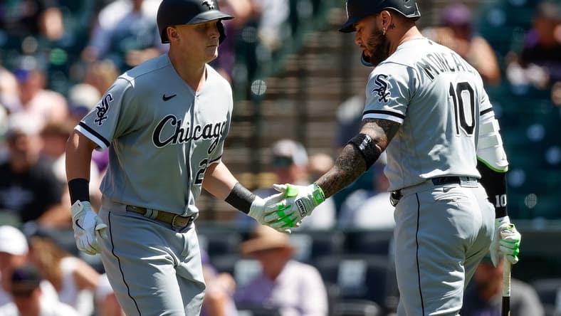Aug 20, 2023; Denver, Colorado, USA; Chicago White Sox designated hitter Andrew Vaughn (25) celebrates his solo home run with third baseman Yoan Moncada (10) in the second inning against the Colorado Rockies at Coors Field. Mandatory Credit: Isaiah J. Downing-USA TODAY Sports