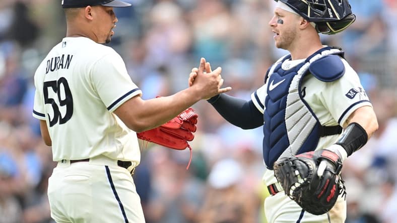 Aug 20, 2023; Minneapolis, Minnesota, USA; Minnesota Twins relief pitcher Jhoan Duran (59) and catcher Ryan Jeffers (27) react after the game against the Pittsburgh Pirates at Target Field. Mandatory Credit: Jeffrey Becker-USA TODAY Sports