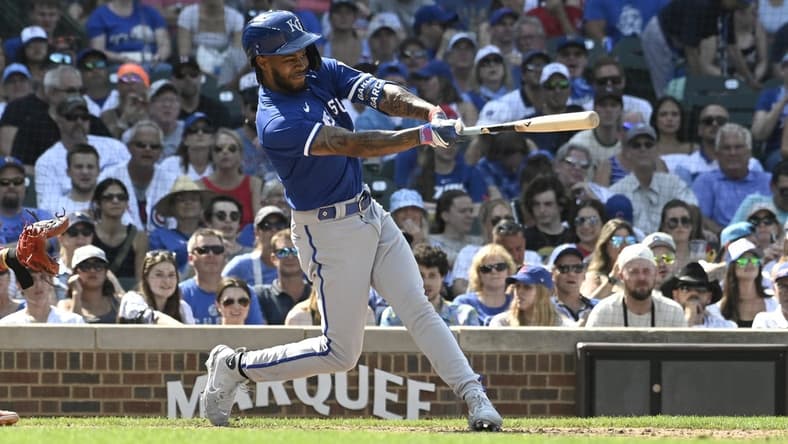 Aug 20, 2023; Chicago, Illinois, USA; Kansas City Royals third baseman Maikel Garcia (11) hits an RBI single against the Chicago Cubs during the ninth inning at Wrigley Field. Mandatory Credit: Matt Marton-USA TODAY Sports