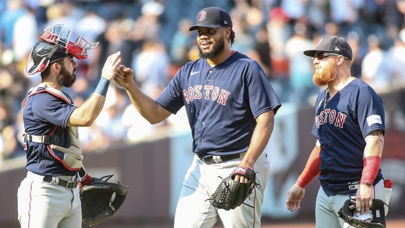 Aug 20, 2023; Bronx, New York, USA; Boston Red Sox relief pitcher Kenley Jansen (74) celebrates with catcher Connor Wong (12) and first baseman Justin Turner (2) after defeating the New York Yankees 6-5 at Yankee Stadium. Mandatory Credit: Wendell Cruz-USA TODAY Sports