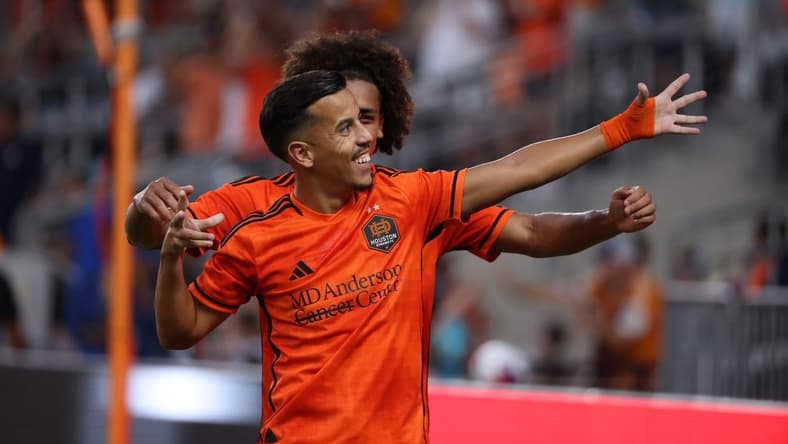 Aug 20, 2023; Houston, Texas, USA; Houston Dynamo midfielder Amine Bassi (8) celebrates after scoring a goal with teammate during the first half at Shell Energy Stadium. Mandatory Credit: Thomas Shea-USA TODAY Sports