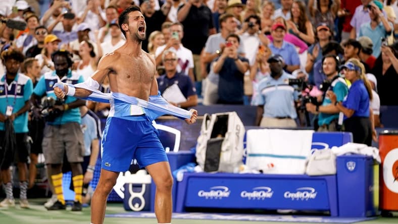 Novak Djokovic, of Serbia, rips his shirt in celebration after defeating Carlos Alcaraz, of Spain, at the conclusion of the men s singles final of the Western & Southern Open tennis tournament, Sunday, Aug. 20, 2023, at the Lindner Family Tennis Center in Mason, Ohio. Djokovic won, 5-7, 7-6, 7-6.