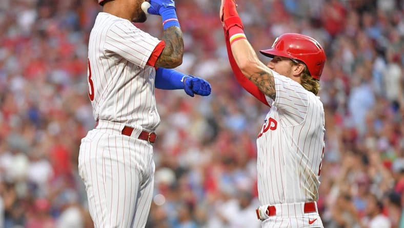 Aug 21, 2023; Philadelphia, Pennsylvania, USA; Philadelphia Phillies third baseman Edmundo Sosa (33) celebrates his home run with second baseman Bryson Stott (5) during the second inning against the San Francisco Giants at Citizens Bank Park. Mandatory Credit: Eric Hartline-USA TODAY Sports