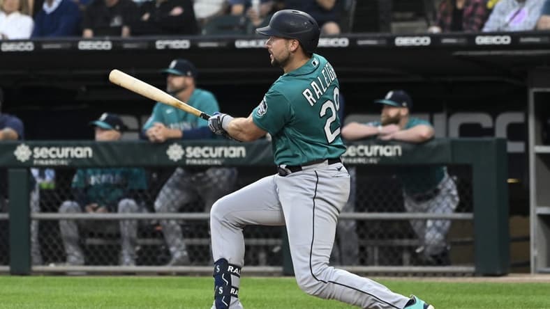 Aug 21, 2023; Chicago, Illinois, USA; Seattle Mariners first baseman Ty France (23) hits a two RBI double against the Chicago White Sox during the first inning at Guaranteed Rate Field. Mandatory Credit: Matt Marton-USA TODAY Sports