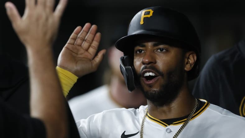 Aug 21, 2023; Pittsburgh, Pennsylvania, USA;  Pittsburgh Pirates right fielder Joshua Palacios (54) high-fives in the dugout after scoring a run against the St. Louis Cardinals during the eighth inning at PNC Park. Pittsburgh won 1-1. Mandatory Credit: Charles LeClaire-USA TODAY Sports
