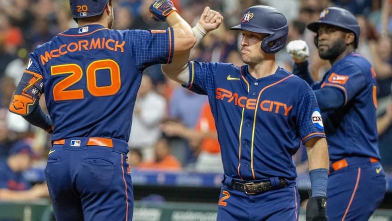 Aug 21, 2023; Houston, Texas, USA; Houston Astros third baseman Alex Bregman (2) and designated hitter Yordan Alvarez (44) celebrate left fielder Chas McCormick (20) three run home run against the Boston Red Sox in the fourth inning at Minute Maid Park. Mandatory Credit: Thomas Shea-USA TODAY Sports