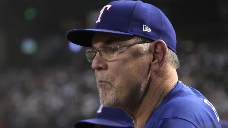 Aug 21, 2023; Phoenix, Arizona, USA; Texas Rangers manager Bruce Bochy (15) watches game action against the Arizona Diamondbacks during the third inning at Chase Field. Mandatory Credit: Rick Scuteri-USA TODAY Sports