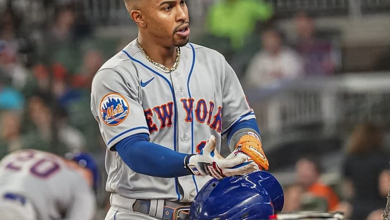 Aug 21, 2023; Cumberland, Georgia, USA; New York Mets shortstop Francisco Lindor (12) reacts at the dugout steps after hitting a three run home run against the Atlanta Braves during the sixth inning at Truist Park. Mandatory Credit: Dale Zanine-USA TODAY Sports