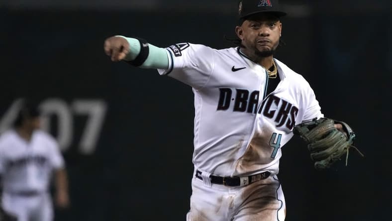 Aug 21, 2023; Phoenix, Arizona, USA; Arizona Diamondbacks second baseman Ketel Marte (4) makes the play for an out against the Texas Rangers during the sixth inning at Chase Field. Mandatory Credit: Rick Scuteri-USA TODAY Sports