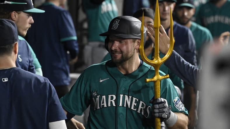 Aug 21, 2023; Chicago, Illinois, USA;  Seattle Mariners catcher Cal Raleigh (29) celebrates in the dugout after he hits a three run home run against the Chicago White Sox during the eighth inning at Guaranteed Rate Field. Mandatory Credit: Matt Marton-USA TODAY Sports