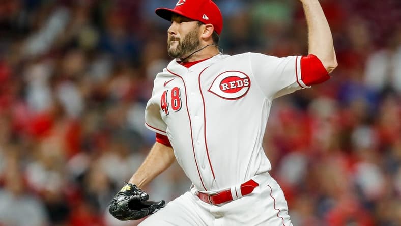 Aug 15, 2023; Cincinnati, Ohio, USA; Cincinnati Reds relief pitcher Alex Young (48) pitches against the Cleveland Guardians in the eighth inning at Great American Ball Park. Mandatory Credit: Katie Stratman-USA TODAY Sports