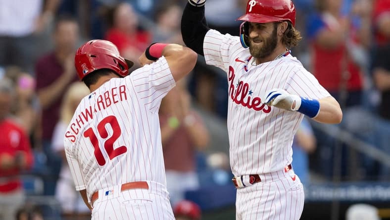 Aug 22, 2023; Philadelphia, Pennsylvania, USA; Philadelphia Phillies designated hitter Bryce Harper (3) celebrates with left fielder Kyle Schwarber (12) after hitting a two RBI home run during the first inning against the San Francisco Giants at Citizens Bank Park. Mandatory Credit: Bill Streicher-USA TODAY Sports